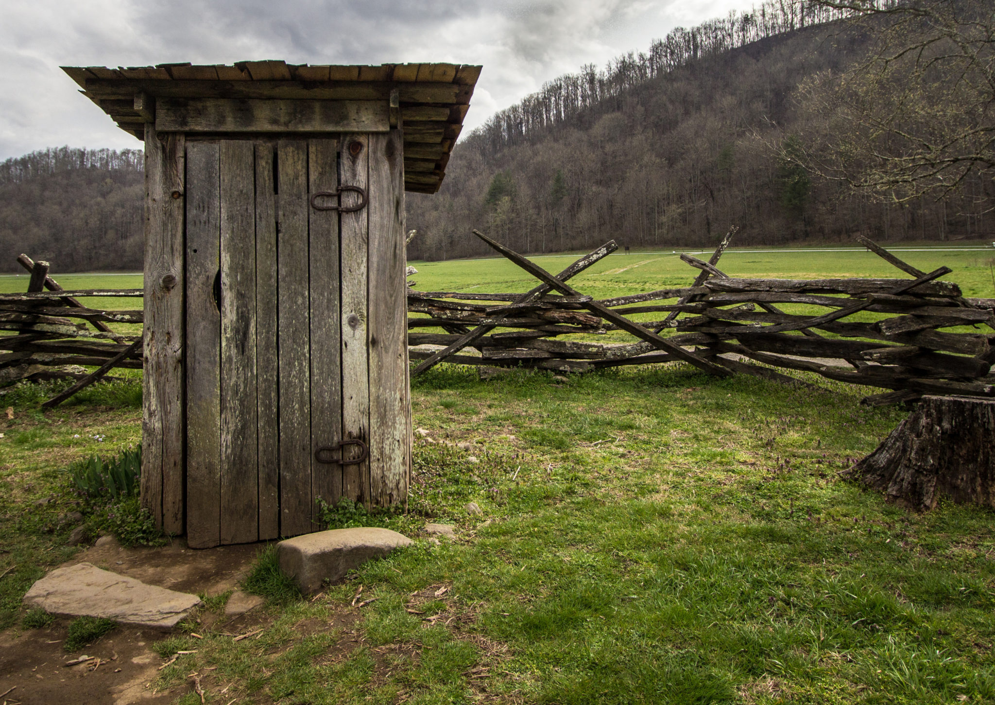 Old outhouse in a field