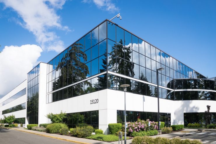 White office building with reflective windows